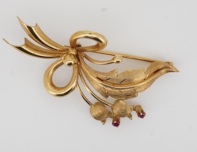 A modern 18k and two stone ruby set foliate spray brooch, 50mm, gross weight 6.7 grams. Condition - fair to good